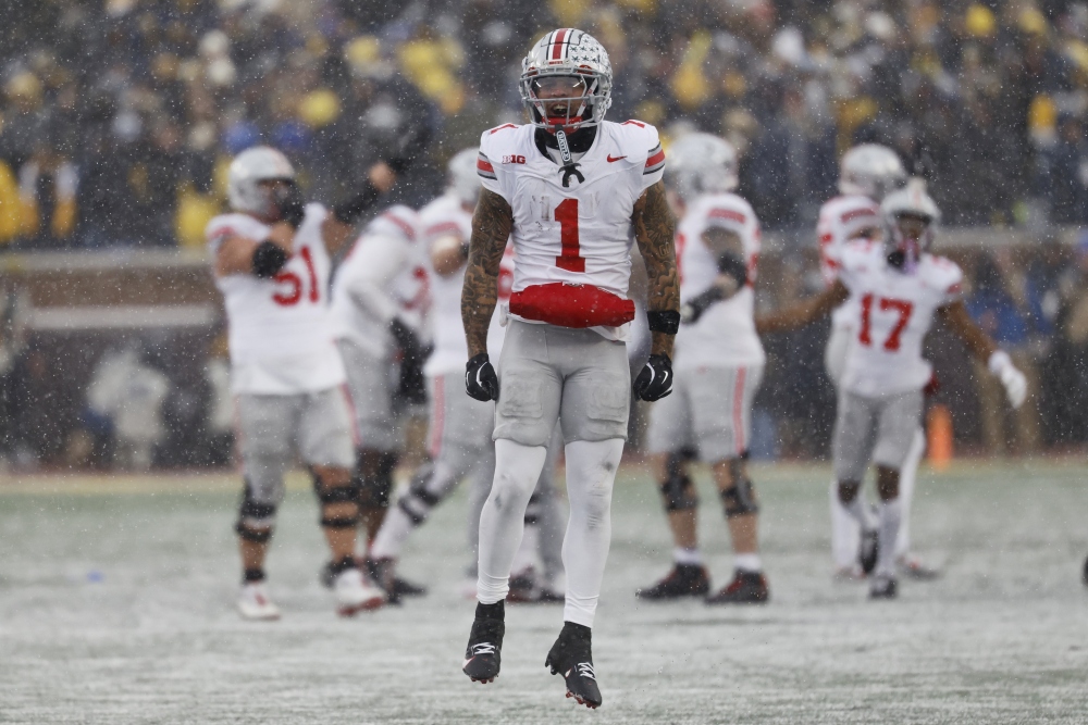 Caption: Nov 29, 2025; Ann Arbor, Michigan, USA; Ohio State Buckeyes wide receiver Brandon Inniss (1) celebrates in the second half against the Michigan Wolverines at Michigan Stadium. Mandatory Credit: Rick Osentoski-Imagn Images